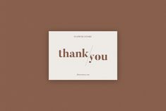 a thank card with the words, thank you on it in brown and white ink