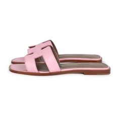 These Hermes Oran Sandals are in Bubblegum Matte Alligator leather, with an H cutout detail, natural leather insoles in a size 37 EU.Origin: ItalyCondition: New and never wornAccompanied by: Hermes box, dustbags, CITES, ribbonSize: 37 EU Pink Leather Slides With Branded Insole, Designer Pink Leather Mules, Pink Leather Slides With Flat Heel, Pink Leather Slides With Leather Footbed, Pink Leather Slides, Spring Sandals With Textured Sole In Calf Leather, Spring Calf Leather Sandals With Textured Sole, Hermes Oran Sandals, Hermes Box