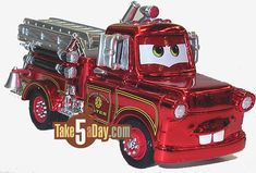 a red toy truck with a firetruck on the front and an angry face painted on the back