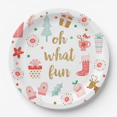 a paper plate with the words oh what fun written in gold foil on it, surrounded by christmas decorations and presents