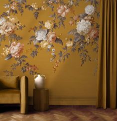 a living room with yellow walls and flowers painted on it's wallpapers