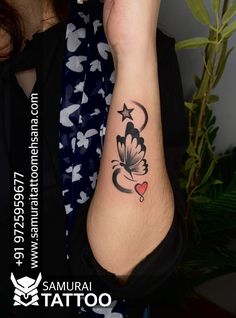 a woman's arm with a butterfly tattoo on the left side of her body