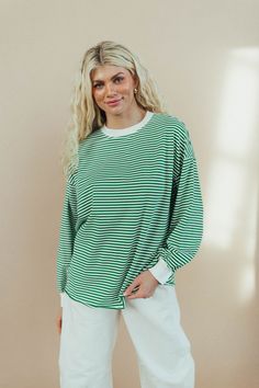 Watch the try on video for this style (swipe through the product photos) for accurate coloring, closeups & sizing guidance! Our sizing suggestion: Runs oversized, size down if you prefer a smaller fit. Bump friendly APPROX. MEASUREMENTS OF STYLE (measurements are taken of the item laying flat)Small (2-6)Upper bust (measured at armpit of item) 25"Length 29"Medium (6-10)Upper bust 26.5"Length 29.5"Large (10-14)Upper bust 28"Length 30" Model is size 2 & 5'11" wearing Small Fabric content: 95 COTTON Bts Clothes, Relaxed Fashion, Causal Outfits, Cute Fit, Stripe Top, Green Tops, Cute Simple Outfits, Product Photos, New Wardrobe