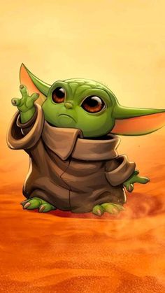 the baby yoda is sitting in the desert