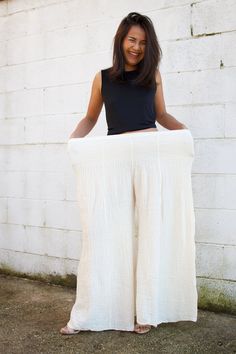 Elevate your wardrobe with our stylish Veda Wide Leg Pants. Available in a spectrum of colors, these full-length pants feature a wide leg and a snug waist with multiple elastic bands, ensuring a perfect fit without compromising comfort. Crafted from breathable 100% cotton fabric, they effortlessly transition from events to casual relaxation. Embrace versatility and chic comfort in every wear Stretch Wide-leg Harem Pants For Loungewear, Versatile Cotton Wide-leg Pants, White Wide-leg Yoga Pants With Elastic Waistband, White Wide Leg Yoga Pants With Elastic Waistband, Versatile Cotton Wide Leg Full-length Pants, Versatile Full-length Cotton Wide Leg Pants, Versatile Wide Leg Full Length Cotton Pants, Versatile Full Length Cotton Wide Leg Pants, Versatile Wide Leg Cotton Pants