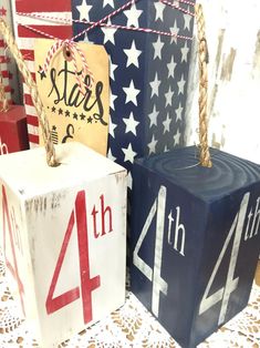 four wooden blocks with numbers and stars on them