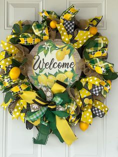 a welcome wreath with yellow and green ribbons