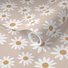 a wallpaper with daisies on it in beige and white colors, featuring gold dots