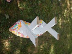 an upside down bench sitting in the grass