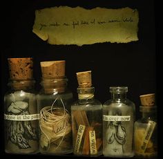 several bottles with writing on them sitting next to each other