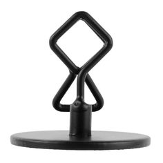 a black metal object sitting on top of a table