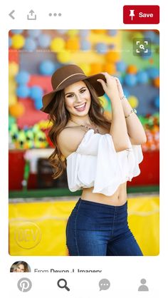 a beautiful young woman in jeans and a hat