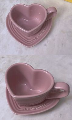 three pink heart shaped dishes sitting on top of each other