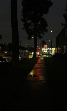 a street at night with the lights on