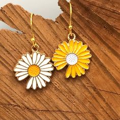 Flower Earrings, Flower Jewelry, Spring Earrings, Spring Jewelry, Fun Flower Earrings, Mismatched Flower Earrings, Daisy Earrings, Daisies  She loves me, she loves me not...of course she loves you!! Celebrate the return of the flowers with these adorable daisies, just waiting to be plucked! - comprised of skin safe hypoallergenic enamel - comes gift ready on a hand stamped card in a cute organza bag - please choose between matching white, matching yellow, or      mismatched - all components are Cute Flower-shaped Pierced Earrings, Gold Daisy Flower Earrings As Gift, Gold Daisy Earrings With Flower Charm, Yellow Flower Charm Earrings As Gift, Yellow Earrings With Flower Charm For Gift, Flower-shaped Single Earring For Gift, Flower Earrings For Mother's Day, Mother's Day Flower Charm Drop Earrings, Mother's Day Flower Shaped Earrings With Charm