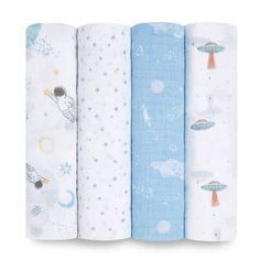 four baby swaddles are lined up in different colors and designs, each with an outer space theme