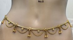 * Beautifully designed gold color belly chain. * can be used with belly dance costumes and saris. * D.no.1- Adjustable from 24 to 41 inches Waist. * D.no.2- Adjustable from 25 to 40 inches Waist. * D.no.3- Adjustable from 25 to 40 inches Waist. * D.no.4- Adjustable from 24 to 40 inches Waist. *D.no.5- Adjustable from 24 to 38 Indian Belly Chain, Elegant Gold Waist Chain For Festivals, Gold Bollywood Waist Chain For Festivals, Gold Bollywood Waist Chain For Wedding, Gold Waist Chain For Festivals And Parties, Bollywood Gold Waist Chain For Weddings, Gold Waist Chain For Party And Festivals, Bollywood Style Gold Waist Chain For Wedding, Bohemian Gold Body Chain For Wedding