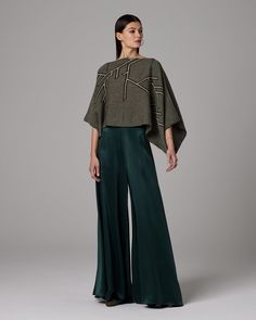 Flowing silk charmeuse pants move beautifully to feature the dramatic palazzo leg. 100% Silk Charmeuse Made in New York City Product Care: Dry Clean Only Styled with Bishop Sleeve Blouse and Liquid Silk Tank Silk Palazzo Pants, Bishop Sleeve Blouse, Mini Wrap Skirt, Wide Trousers, Bishop Sleeve, Silk Tank, Silk Pants, Silk Charmeuse, Wrap Blouse