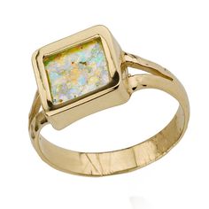 our exquisite Roman Glass Square Ring, a unique signet ring crafted in 14K gold, showcasing the iridescent beauty of genuine Roman Glass. This stunning ring captures the essence of history and elegance, creating a statement piece that will leave a lasting impression. The Roman Glass used in this ring holds a captivating tale of antiquity, originating from fragments of ancient vessels and artifacts that have been carefully collected from the excavations in Judea. Each piece of glass carries a unique history, making this signet ring truly one-of-a-kind. The ring has a square top, enclosed in which is a stunning shard of roman glass, iridescent in its sheen. Each shard of roman glass has a color that forms depending on the minerals it is in contact with during formation so you can be sure eac Ancient Vessels, Roman Glass Jewelry, Square Ring, Roman Glass, Square Rings, Ring Crafts, Glass Rings, Ring Dainty, 14k Gold Ring