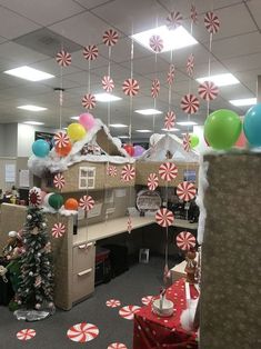 an office decorated for christmas with candy canes and decorations