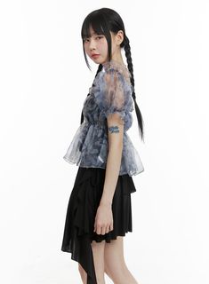 Product Detail Elevate your style with our KPOP-inspired women's fashion collection. Perfect for street and romantic looks, this crop top features shirring, frill, and see-through details. Ideal for festival occasions with a square neck and short sleeves. Style : Street, Romantic Occasion : Festival Detail : Shirring, Frill, See-through Material : Polyester, Rayon Sleeve : Short sleeve Neck : Square neck Length : Crop Fit : Normal fit Polyester 95 Rayon 5 Color : Blue Model Size Model is wearing Summer Evening Chiffon Top, Trendy Chiffon Tops For Party, Trendy Chiffon Party Tops, Organza Tops With Sheer Sleeves, Trendy Ruffled Short Sleeve Crop Top, Trendy Short Sleeve Ruffled Crop Top, Sheer Crop Top For Summer, Fitted Crop Top With Sheer Sleeves For Summer, Chic Short Sleeve Crop Top With Ruffles