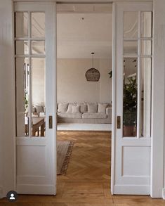 an open door leading into a living room