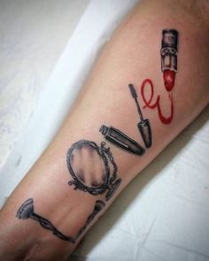 a person with a tattoo on their arm that has the word love written in it