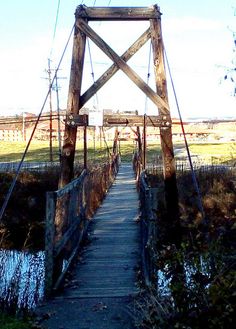 a wooden bridge over a small body of water