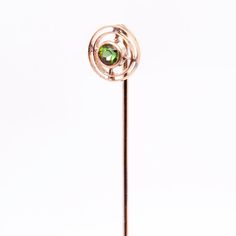 A very fine Edwardian tourmaline stickpin.  In 10k yellow gold.  With concentric gold circles surrounding a round faceted, bezel set green tourmaline gemstone.  Simply a great stickpin!  Date: Early 20th Century  Overall Condition: It is in overall good, as-pictured, used estate condition with some very fine & light surface scratches and other signs of expected light wear consistent with age.  Fineness: Professionally tests at 10k.  Marks: Struck with a hard to read mark (probably 10k)  Measurem Tourmaline Gemstone, Best Wear, Green Tourmaline, 10k Gold, Bezel Setting, Early 20th Century, Tourmaline, Vintage Antiques, Circles