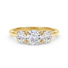 three stone diamond ring in yellow gold