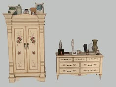 an old dresser and armoire with two cats on it's top one is white, the other is beige