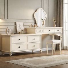 a white dresser with a mirror and stool in a room next to a rug on the floor