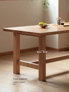 a wooden table with measurements for the top