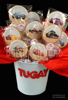 a bucket filled with lots of cookies sitting on top of a table