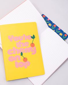 two notebooks with the words how to make cherry pop on them next to each other