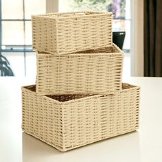 two wicker baskets stacked on top of each other