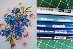 some blue flowers are next to some colored pencils