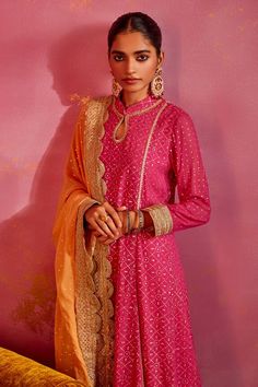 Rani pink georgette kurta with mukaish and lace embroidery. Comes with sharara and a saffron dupatta. - Aza Fashions Pink Traditional Wear With Gota Work For Designer Occasions, Designer Pink Sharara With Dori Work, Pink Sets With Dori Work For Transitional Season, Transitional Pink Sets With Dori Work, Diwali Pink Palazzo Set With Dori Work, Pink Palazzo Set For Festive Occasions During Eid, Fitted Pink Palazzo Set For Transitional Season, Traditional Pink Palazzo Set With Gota Work, Pink Chinon Kurta For Diwali