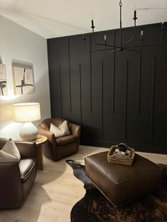 Accent wall, black wall, benjamin moore onyx, cowhide, style Big Plain Wall Ideas, Black Walls In House, Easy Black Accent Wall, Moody Office Accent Wall, Black Wood Accent Wall Living Room, Brown Walls Black Trim, Black Accent Wall In Kitchen, Office Black Accent Wall, Accent Wall Business