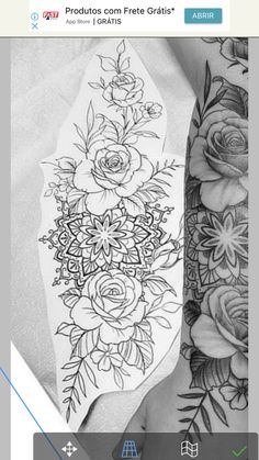 a woman's arm with flowers and leaves on it