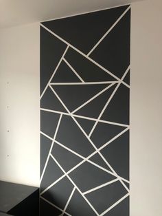 a black and white wall with lines painted on it