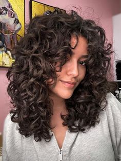 26 Ideas for Curtain Bangs to Ask Your Stylist For | The Everygirl 90s Layered Curly Hair, Short Layers Long Hair Curly, Curly Shag Curtain Bangs, Curly Haircut With Curtain Bangs, Curly Hair Cuts With Layers And Curtain Bangs Long, Curly Hair For Round Faces, Curtain Bangs With Curls, Curly Shag With Curtain Bangs, Layered Curly Haircuts With Bangs