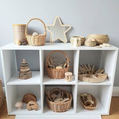 a shelf with baskets and toys on it