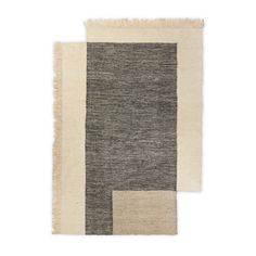 two rugs, one in grey and the other in white with fringes on them