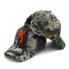 a mossy baseball cap with an orange gecko on it