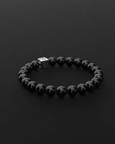 Experience simplicity at its finest with the Essential Bracelet. This piece embodies the elegance of minimalism, crafted for those who find beauty in understatement. It's a subtle yet powerful expression of self, perfect for visionaries who appreciate the grace in simplicity and make their mark with a quiet yet impactful presence. All our stones are chosen by hand to satisfy AAA quality standards. They are natural stones and their size and color can vary slightly. Stone: AAA Grade 8mm Metal: 925 Luxury Sterling Silver Bracelet For Everyday, Timeless Everyday Bracelet With Sterling Silver Clasp, Classic Black Jewelry For Everyday Luxury, Luxury Everyday Sterling Silver Bracelet In White Gold, Modern Silver Bracelets For Everyday Luxury, Classic Adjustable Jewelry With 8mm Beads, Adjustable Silver Bracelets For Everyday Luxury, Minimalist Everyday Bracelets With 8mm Beads, Minimalist Everyday Bracelet With 8mm Beads