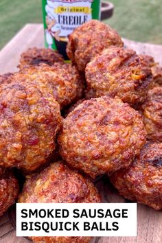 some meatballs are piled on top of each other with the words smoked sausage biscuit balls