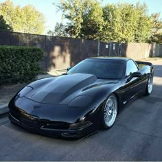 a black sports car parked on the street