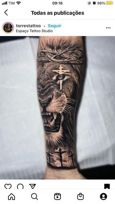 a man's arm with a lion and cross tattoo on the left side of his arm