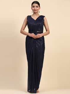 Make a stunning fashion statement at parties and receptions with our charming navy blue sequins lycra party wear pre-stitched saree. This ready-to-wear saree comes with exquisite sequin work and embroidered details, adding a touch of elegance and sophistication to your look.
The matching lycra blouse with heavy sequin work complements the saree perfectly, while the designer belt with sequin work adds a chic finishing touch. With a length of 5.50 meters, this saree is designed for convenience and style.